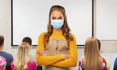 Image showing student girl in mask with crossed arms at school