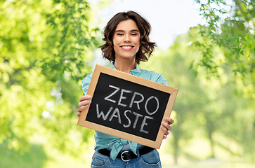 Image showing happy woman with chalkboard with zero waste words