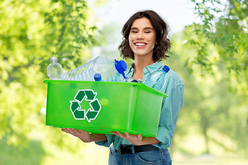 Image showing smiling young woman sorting plastic waste