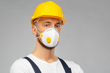 Image showing male worker or builder in helmet and respirator