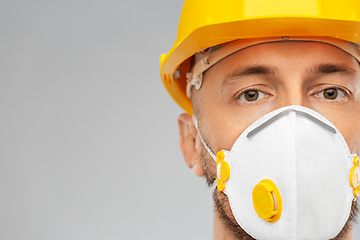 Image showing male worker or builder in helmet and respirator