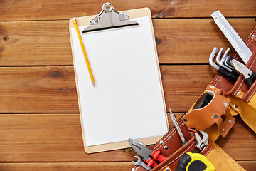 Image showing clipboard, pencil and tool belt on wooden boards