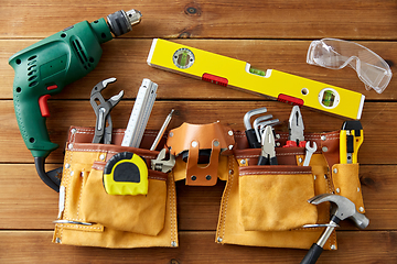 Image showing different work tools on wooden boards