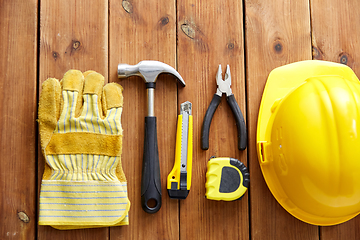 Image showing different work tools on wooden boards