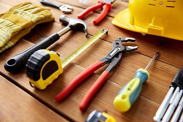 Image showing different work tools on wooden boards