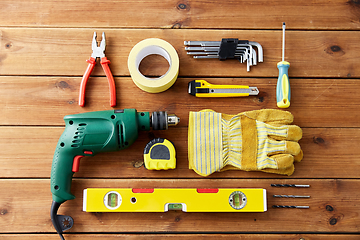 Image showing different work tools on wooden boards