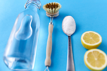 Image showing lemons, washing soda, bottle of vinegar and brush