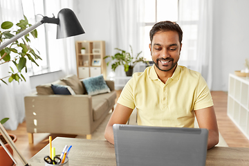 Image showing indian man with laptop working at home office