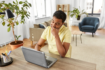 Image showing indian man with laptop working at home office