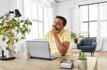 Image showing indian man with laptop working at home office