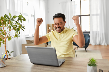 Image showing indian man with laptop working at home office