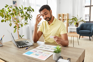 Image showing male ui designer working on user interface at home