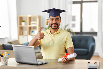 Image showing indian student with laptop and diploma at home