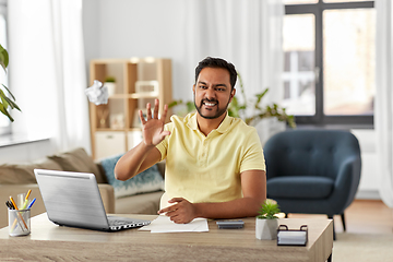 Image showing angry man throwing crumpled paper at home office