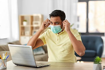 Image showing indian man in mask with laptop at home office