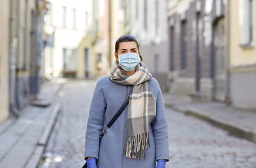 Image showing young woman wearing protective medical mask