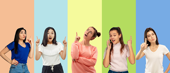 Image showing Portrait of group of emotional people on multicolored background