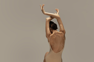 Image showing Young graceful tender ballerina on pastel studio background