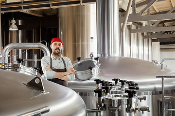 Image showing Professional brewer on his own craft alcohol production