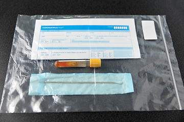 Image showing beaker with test, cotton swab and medical report