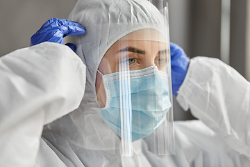 Image showing doctor in protective wear, mask and face shield