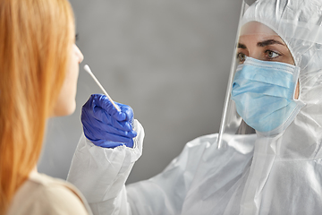Image showing doctor in protective wear making coronavirus test