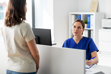 Image showing doctor with computer and patient at hospital