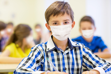 Image showing student boy in protective medical mask at school