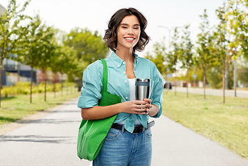 Image showing woman with bag for food shopping and tumbler