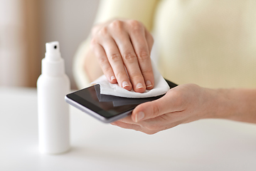 Image showing close up of woman cleaning smartphone