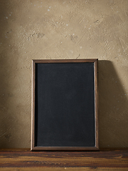 Image showing blackboard in a wooden frame on a table