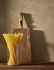 Image showing spaghetti pasta on brown wooden shelf