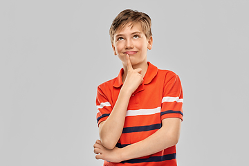 Image showing portrait of happy thinking boy in red polo t-shirt