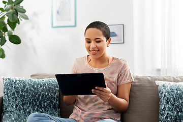 Image showing african american woman with tablet pc at home