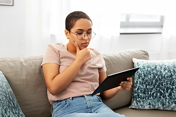 Image showing african american woman with tablet pc at home