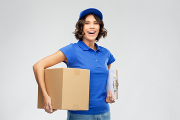 Image showing happy delivery girl with parcel box and clipboard