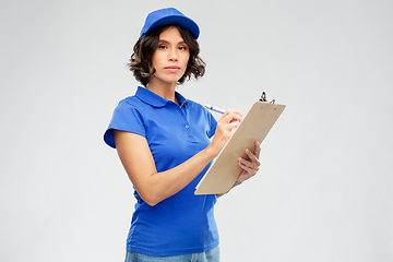 Image showing delivery girl with clipboard and pen writing