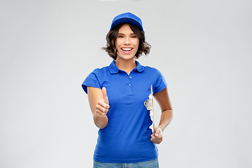 Image showing happy smiling delivery girl with clipboard