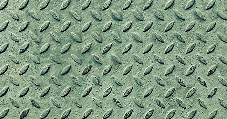 Image showing Old metal diamond plate covered with green paint