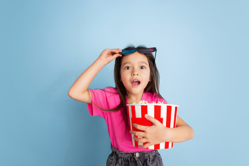 Image showing Caucasian little girl\'s portrait on blue studio background