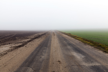 Image showing asphalted road, autumn and fog