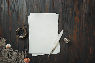 Image showing Old fashioned flat lay with letters writing accessories on dark wooden background