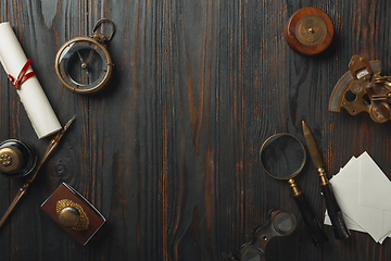 Image showing Old fashioned flat lay with letters writing accessories on dark wooden background