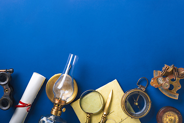 Image showing Old fashioned flat lay with retro accessories on blue background