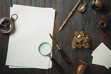 Image showing Old fashioned flat lay with letters writing accessories on dark wooden background