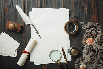 Image showing Old fashioned flat lay with letters writing accessories on dark wooden background