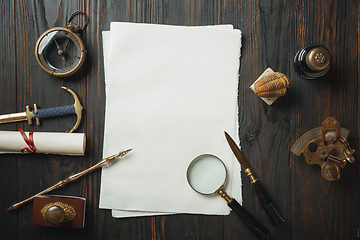 Image showing Old fashioned flat lay with letters writing accessories on dark wooden background