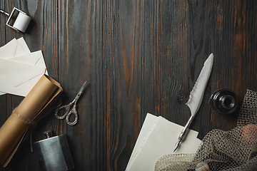 Image showing Old fashioned flat lay with letters writing accessories on dark wooden background