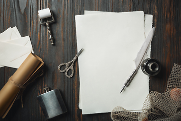 Image showing Old fashioned flat lay with letters writing accessories on dark wooden background