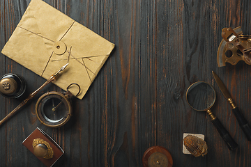 Image showing Old fashioned flat lay with letters writing accessories on dark wooden background